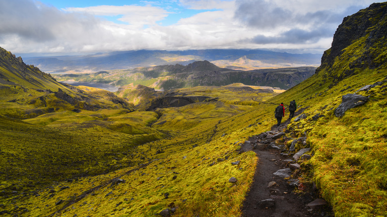 Hikers on volcanic hills in Iceland