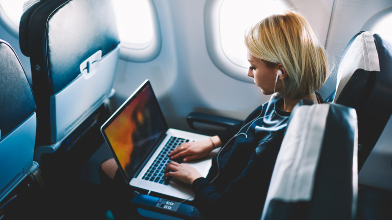 Person using Wi-Fi on a plane