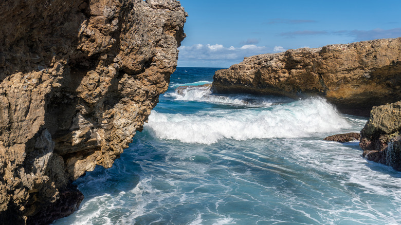 Rocky formations around pocket bay at Shete Boka National Park