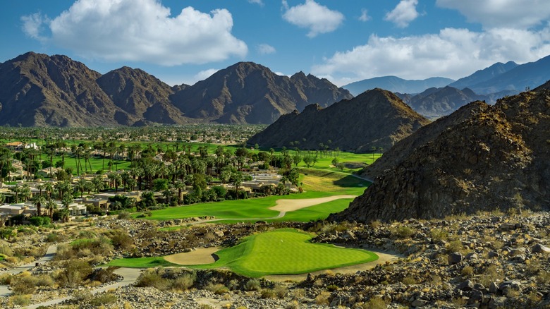 Panoramic aerial view of PGA West golf course surrounded by the Santa Rosa Mountains in California