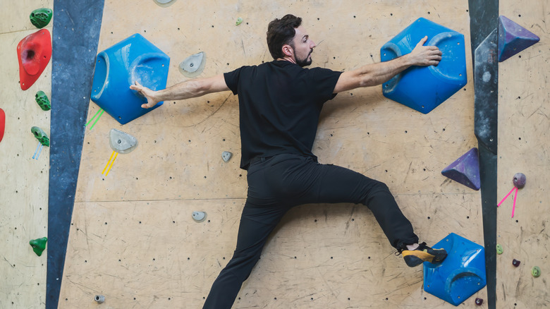 A climber on a manufactured bouldering wall.