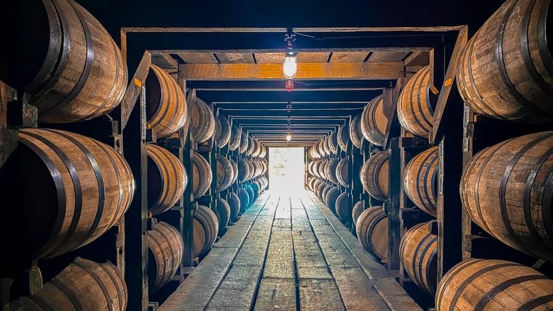 Bourbon barrels aging at distillery