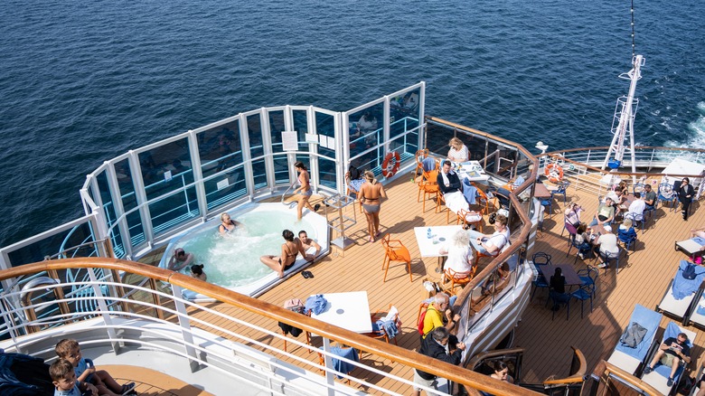 Families in pool on deck of ship on board the Costa Diadema