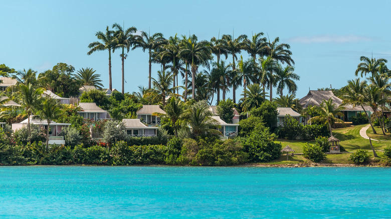 View of the cottages at Cocobay Resort from the water