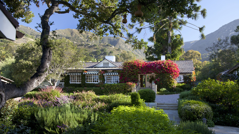 A cottage surrounded by lush gardens at the San Ysidro Ranch in Montecito, California