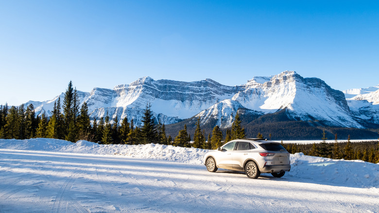 A car on the Icefields Parkway during winter