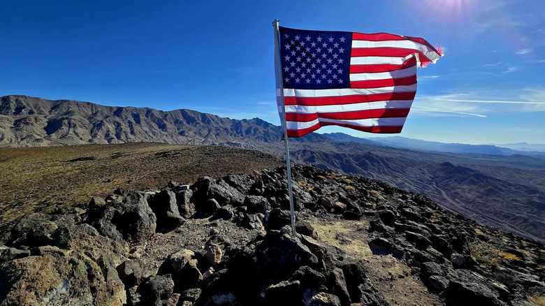 An American flag waves at the top of Fortification Hill