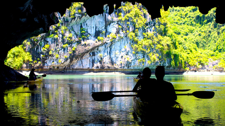 Kayakers in a Cave near Cát Bà Island, Vietnam