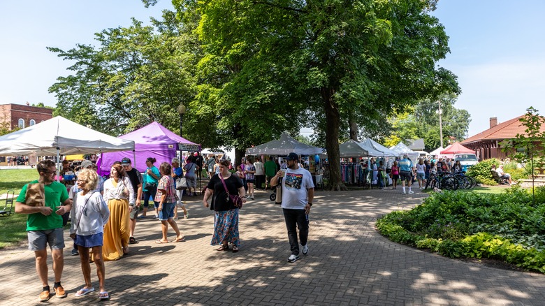 People shopping at Chesterton's European Market outdoor booths