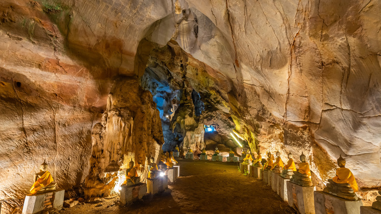 The Wat Tum Marong cave system with the impressive Buddha statues