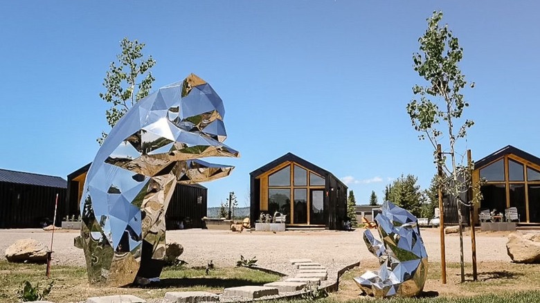 Yellowstone Peaks Hotel cabins with bear sculptures