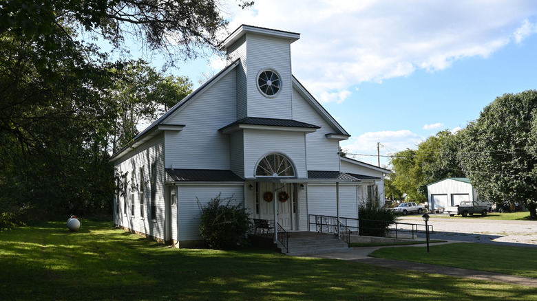 A white church in Bell Buckle, Tennessee on grass