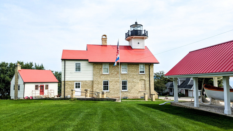 The red-roofed historic light station in Port Washington