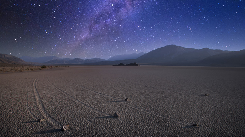 Racetrack Playa moving rocks with galaxy night sky