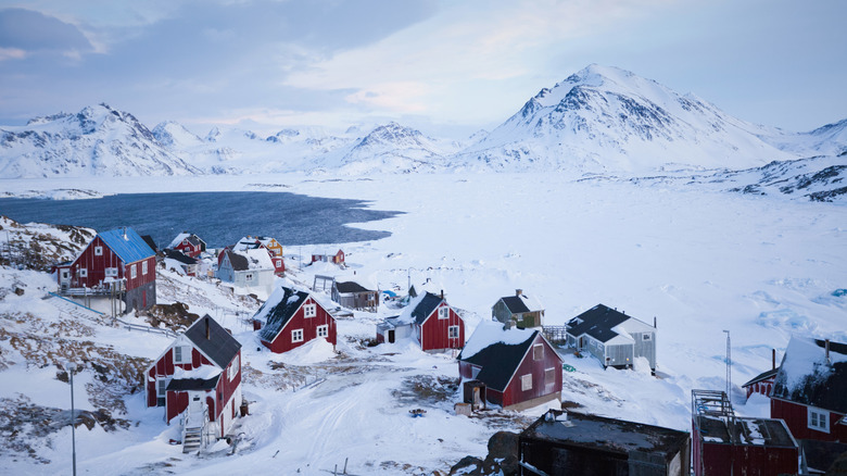 A snowy, mountainous local village in Greenland