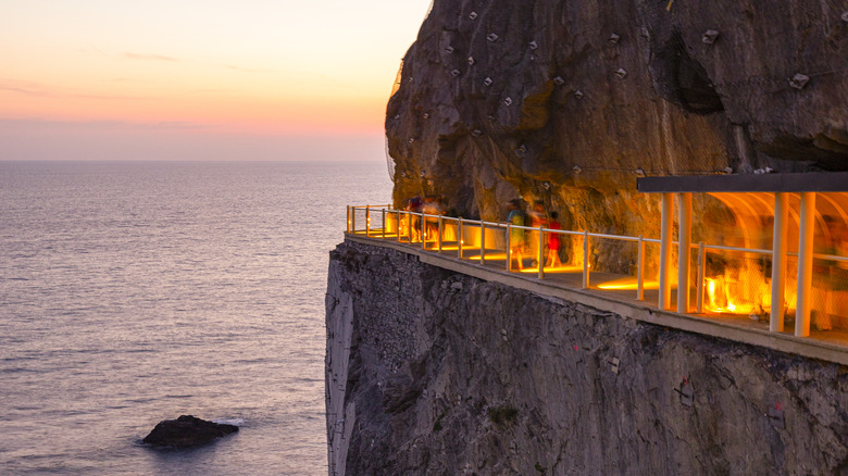 People walking along the Via dell'Amore at sunset