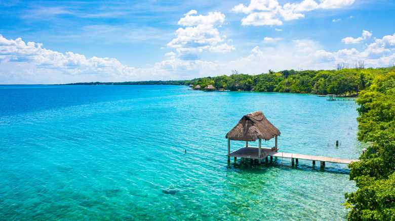 Palapa on a pontoon out into the turquoise waters of Lake Bacalar