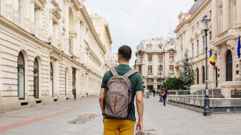 man backpacking in Bucharest