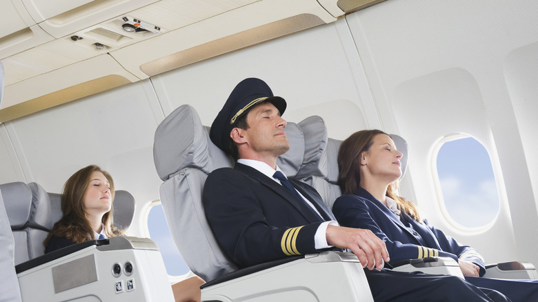 Flight crew resting on plane