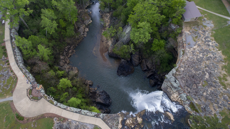 An aerial view of a waterfall and its surrounding observation deck