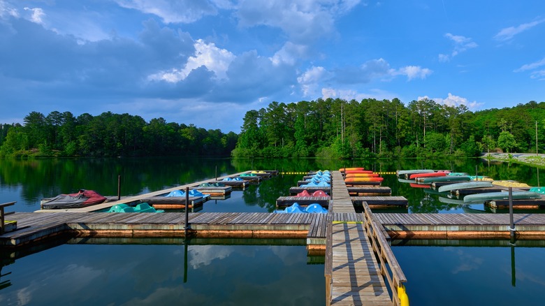 A marina with kayaks and other watercraft at Oak Mountain State Park