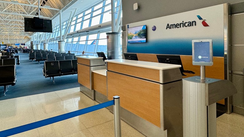 An empty American Airlines gate in an airport