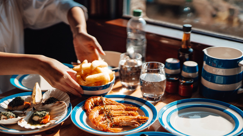 restaurant table in Europe with a small glass of water