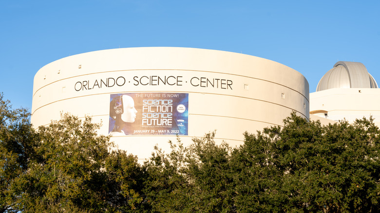 The Orlando Science Center building among trees.