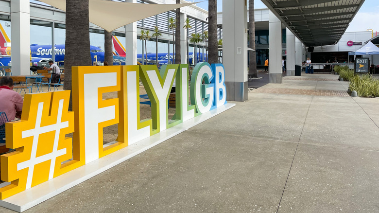 LGB terminal outdoor space with colorful sign in Long Beach, California