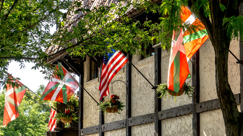 Basque and American flags waving on a building in Boise, Idaho