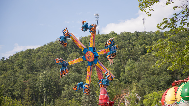 Guests riding a spinning ride at Knoebels