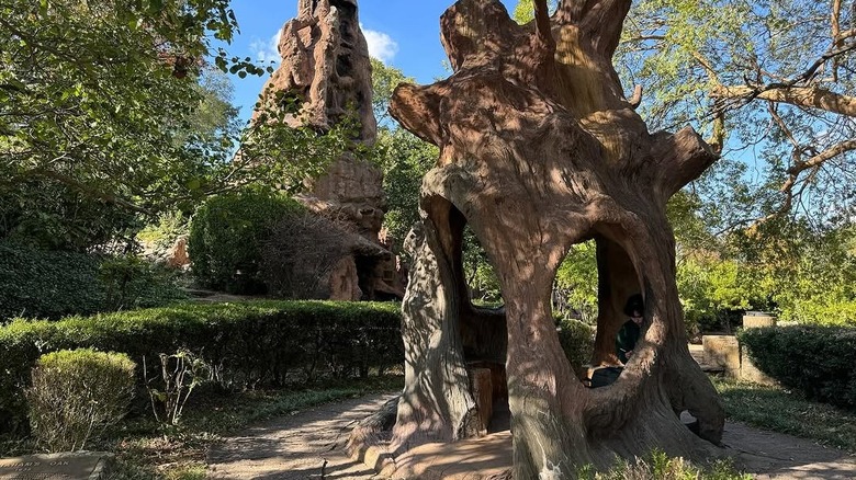 Abraham's Oak sculpture with Crystal Grotto in background