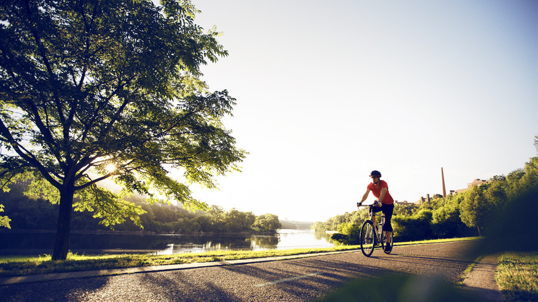 A person riding a bike on a path