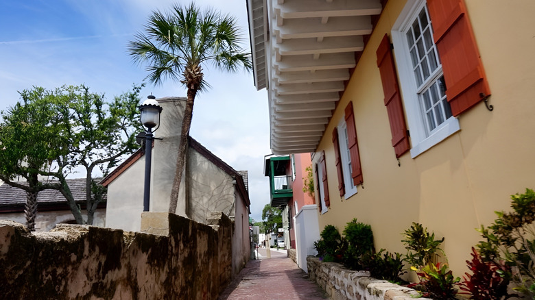 View of Treasury Street lined with bricks and colorful buildings