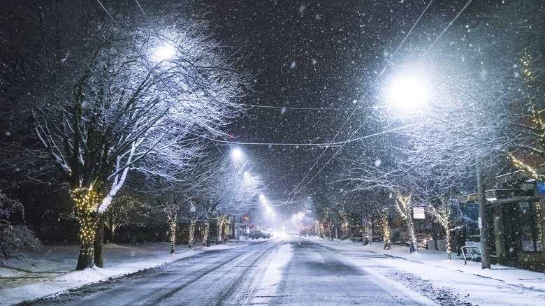 Dark snowy road in Seattle, Washington, at night