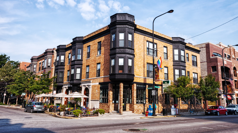 A corner of Boystown (Northalsted), Chicago, featuring shops and a Pride flag