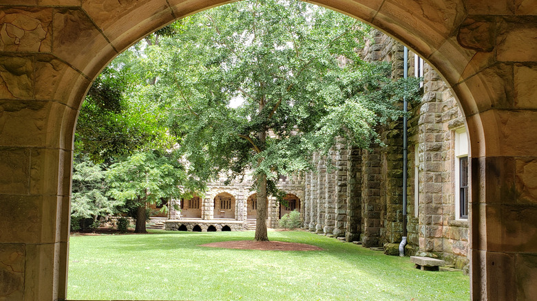 Green courtyard through building opening at Sewanee: The University of the South