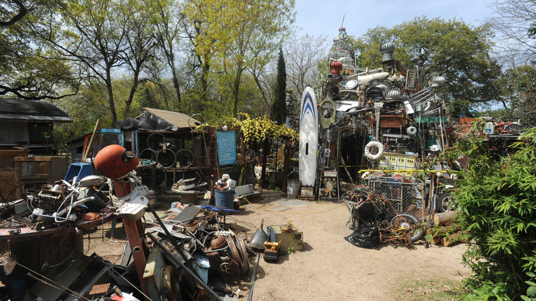 Piles of trash sculptures outside the Cathedral of Junk