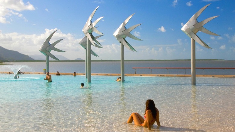 Girl lounging in the Cairns Esplanade Lagoon in Queensland, Australia