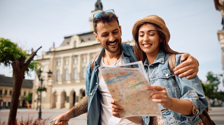 Couple exploring with a map