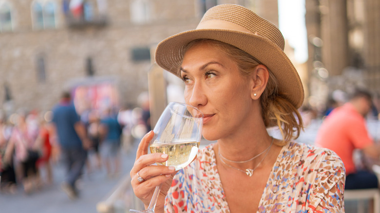 Female tourist enjoying some wine