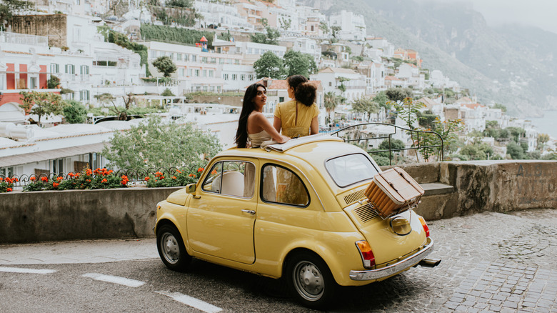 Two women in an old Fiat 500 in Positano, Italy