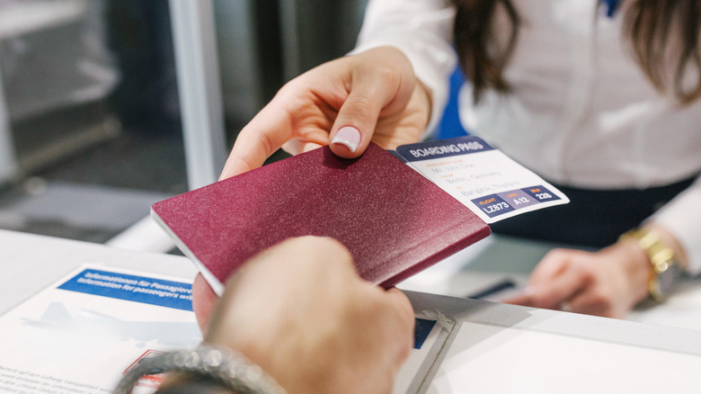 Person handing over passport