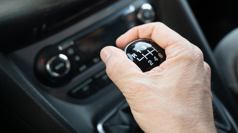 Driver working a manual transmission