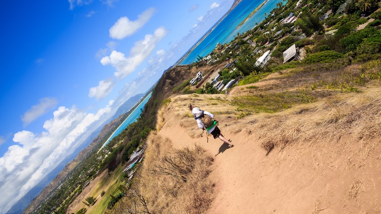 Child riding on hiker's shoulders on Lanikai Pillbox hike