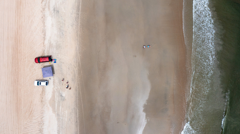 Trucks parked on beach near Carova, North Carolina