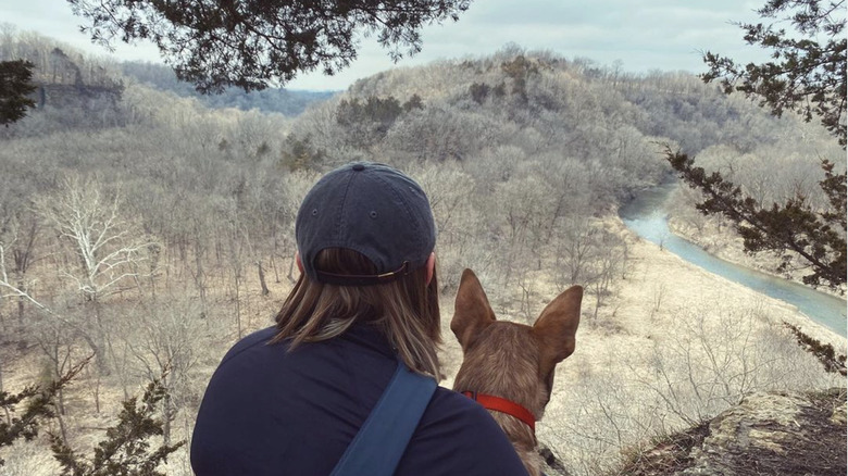 Woman and her dog at Whitewater Canyon Wildlife Area in Iowa