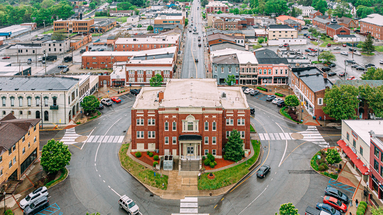 Aerial view of downtown Elizabethtown, featuring a roundabout and brown building in the center