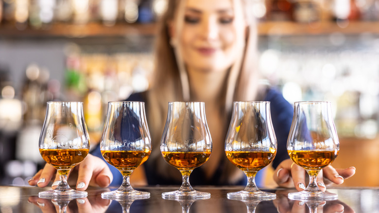 Bartender preparing a flight of bourbon