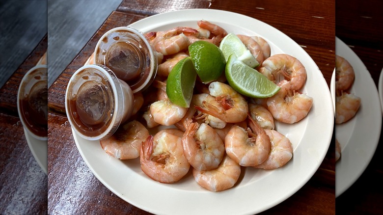 Gulf Shrimp with sauce and lime wedges